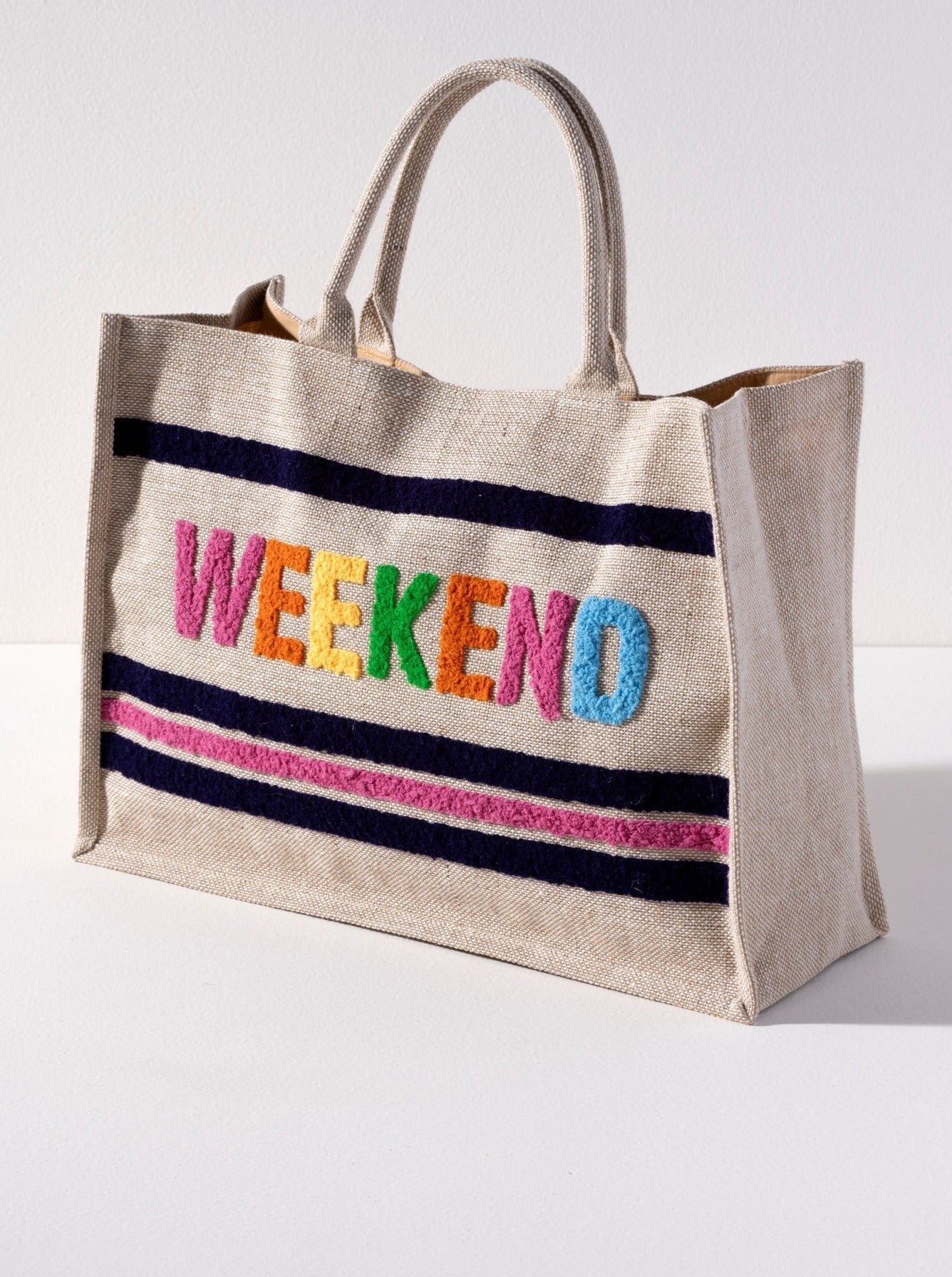 Carry all of your summer essentials for a weekend away in Shiraleah's "Weekend" Beach Bag. Made of durable jute fabric and roomy enough to fit a towel and then some, look no further for your favorite warm weather bag. The trendy toothbrush embroidery adds a pop of color and adds intention to this versatile tote. Pair with other items from Shiraleah to complete your look!