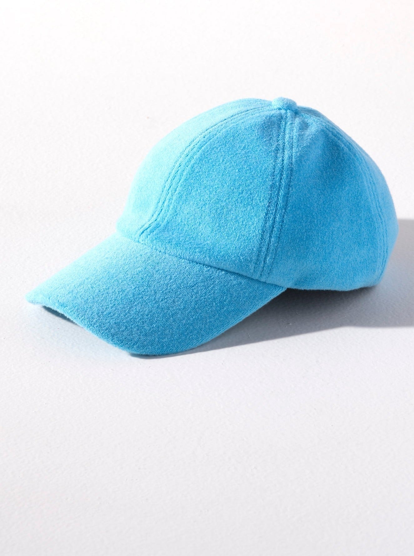 Keep your head shaded and dry this summer with Shiraleah's Sol Ball Hat. Made from soft and absorbent cotton terry, this hat is the perfect poolside companion. Its bright turquoise color matches the rest of Shiraleah's Sol collection. Pair with other items to complete your look!